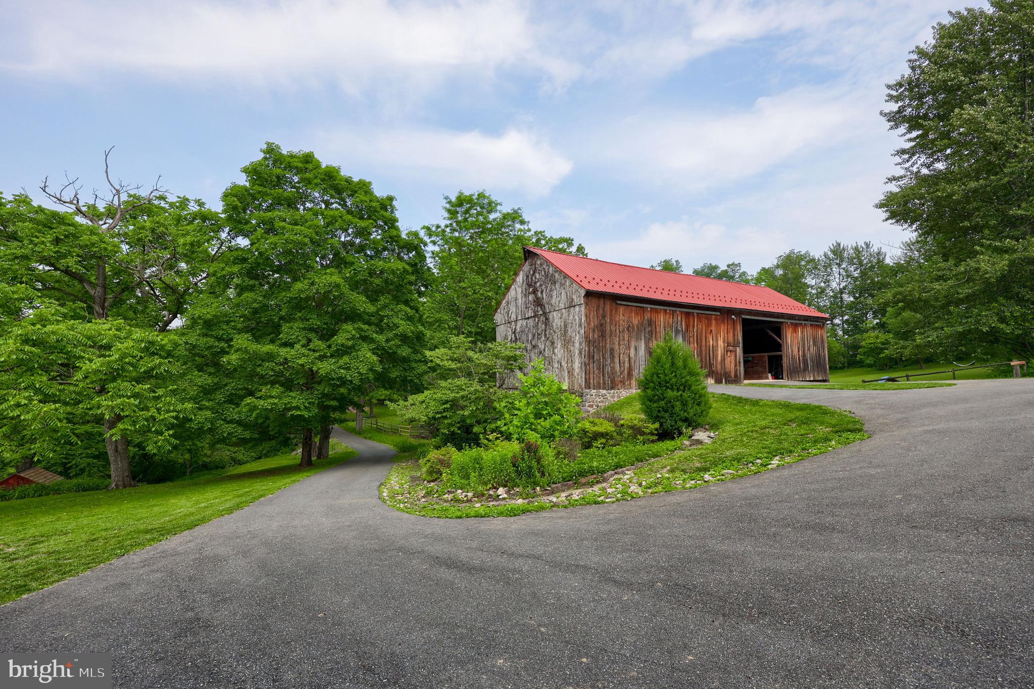 705 Schoffers Road Birdsboro, PA 19508 - Photo 21 of 112 a front view of a house with a yard and garage