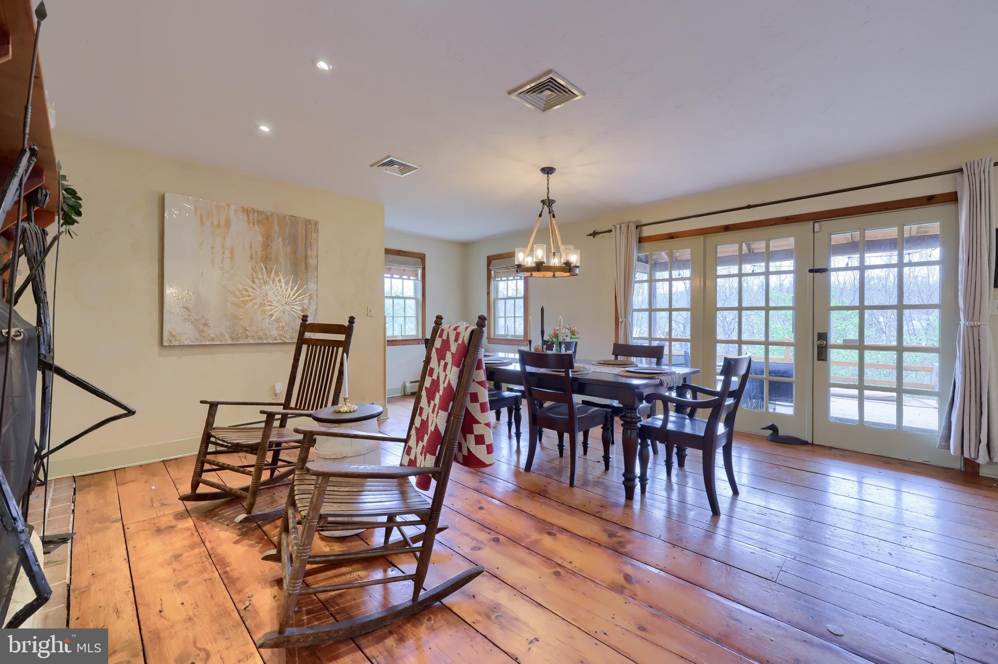 705 Schoffers Road Birdsboro, PA 19508 - Photo 48 of 112 a view of a dining room with furniture and wooden floor