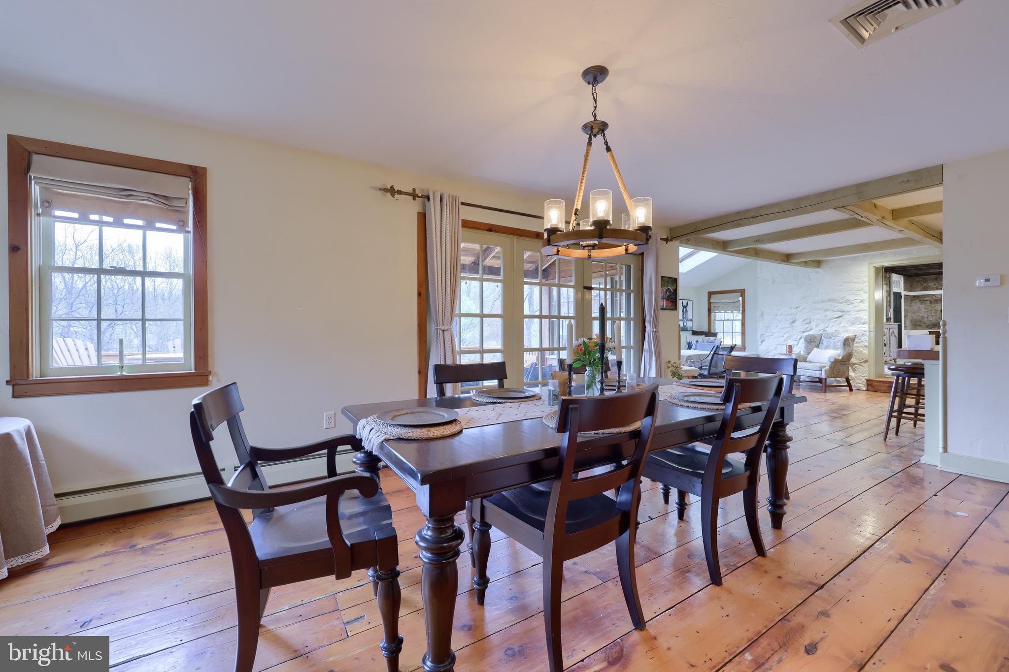 705 Schoffers Road Birdsboro, PA 19508 - Photo 51 of 112 a dining room with furniture window and wooden floor