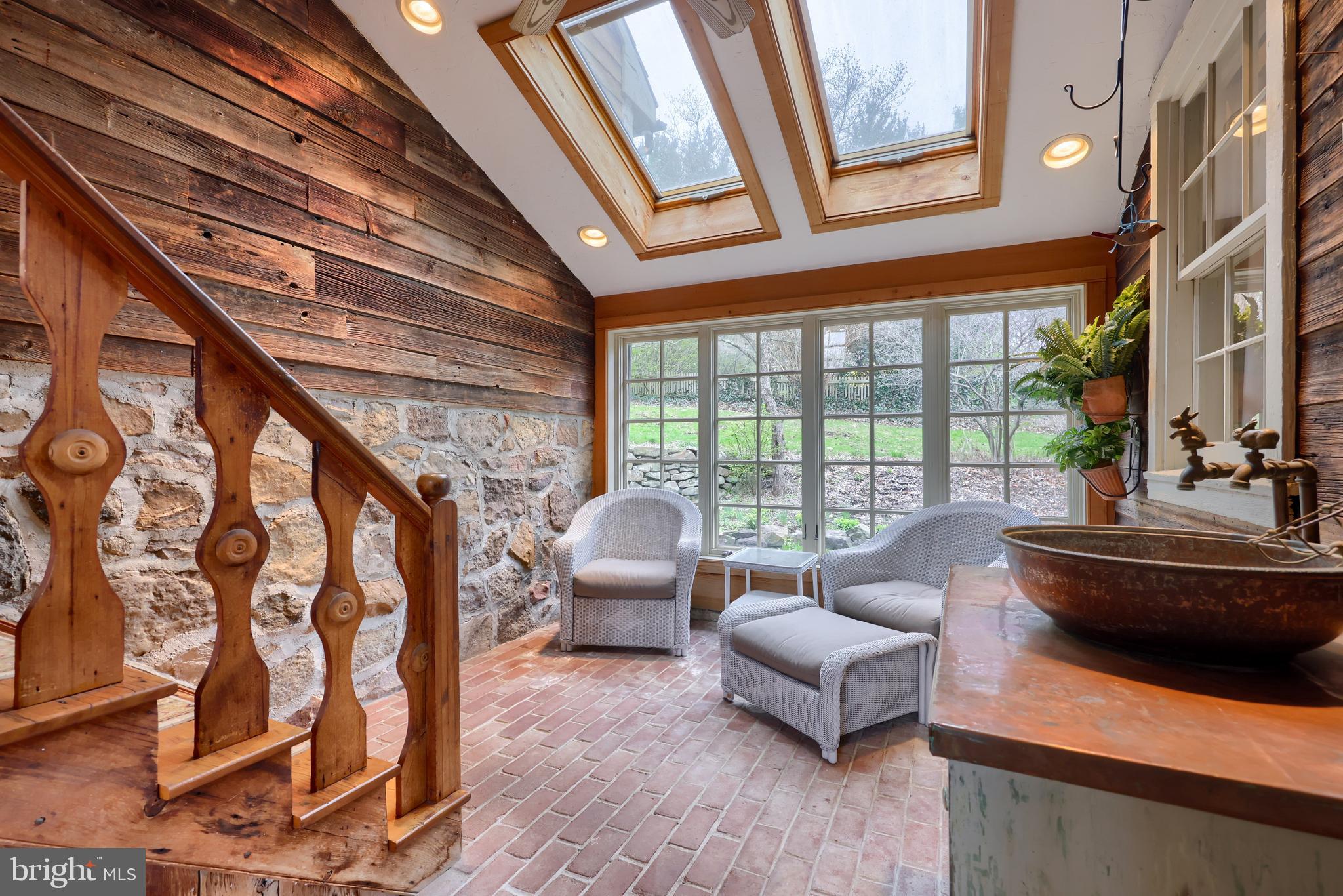 705 Schoffers Road Birdsboro, PA 19508 - Photo 76 of 112 a living room with furniture and a floor to ceiling window
