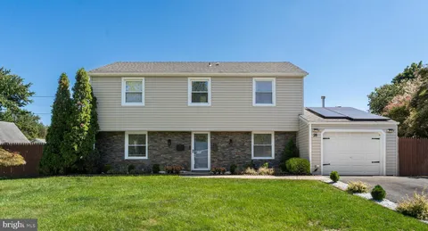 front view of a house and a yard