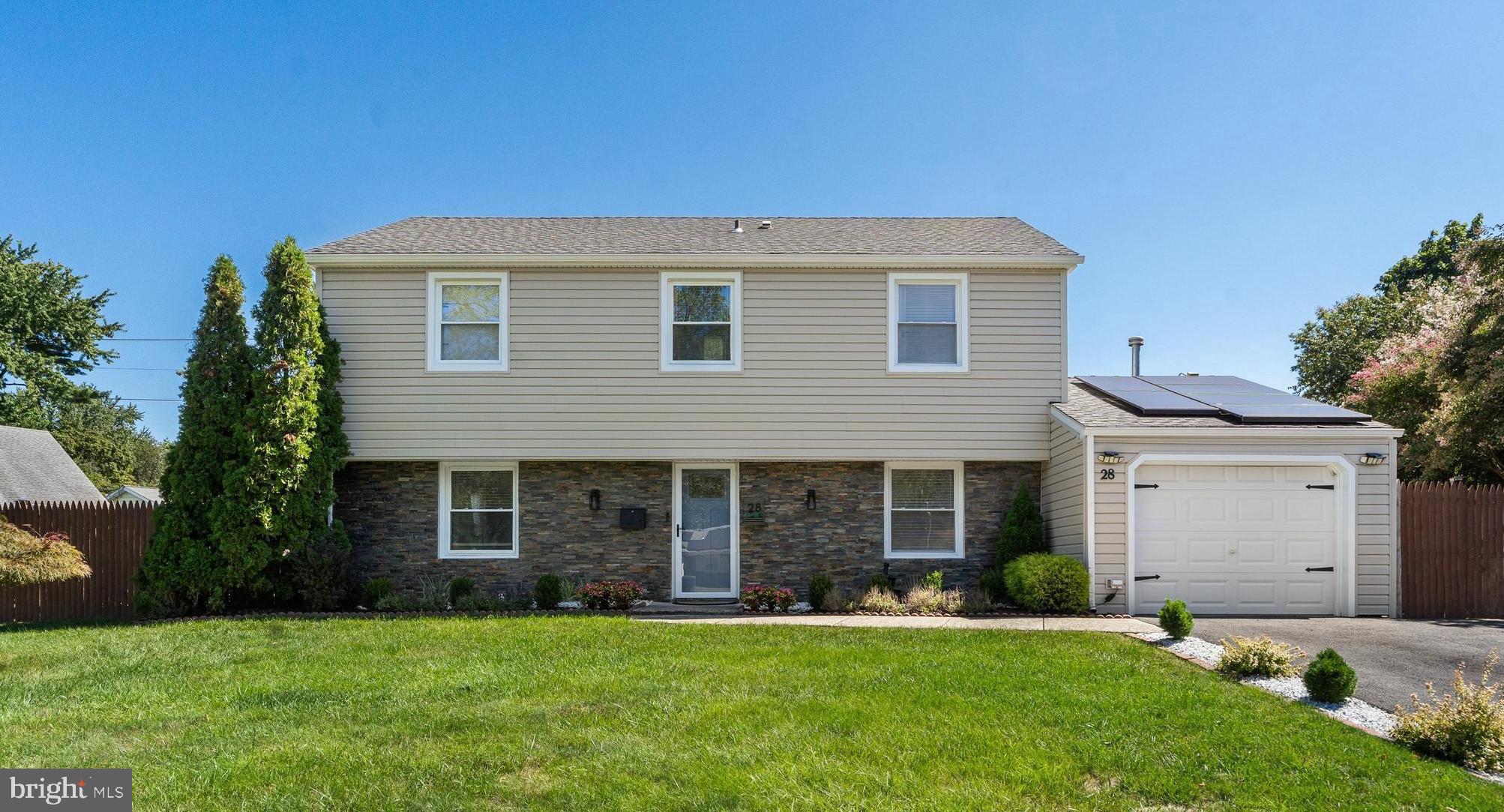 front view of a house and a yard
