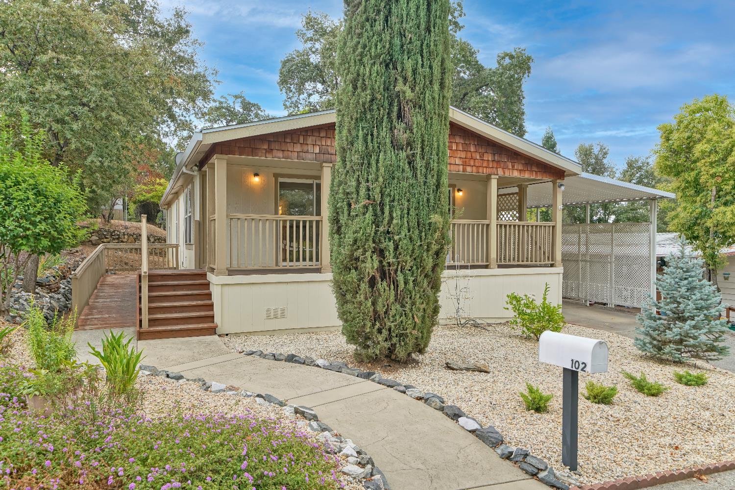 a front view of a house with garden
