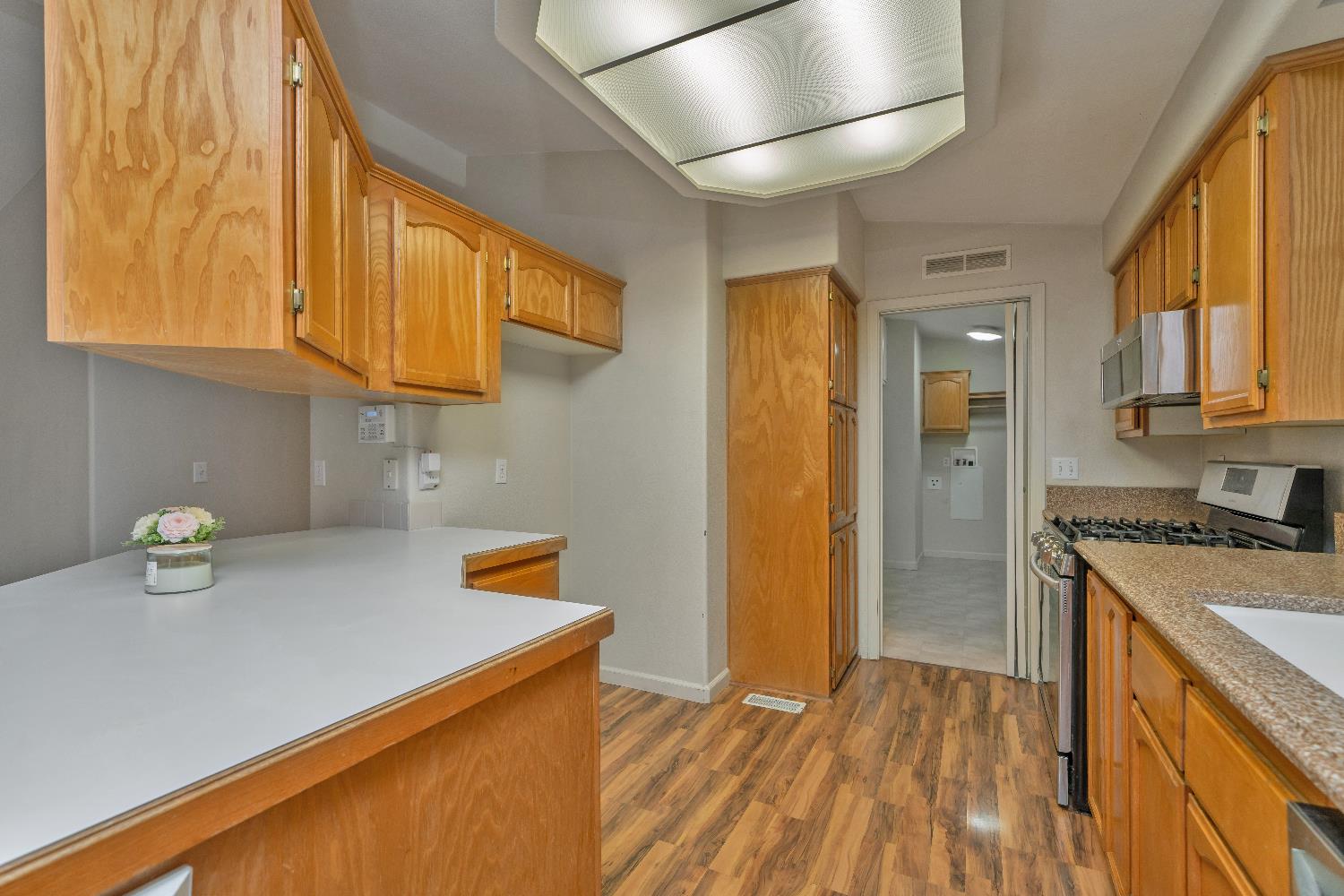 3550 China Garden Road, Unit 102 Placerville, CA 95667 - Photo 11 of 30 a kitchen with a refrigerator and a sink