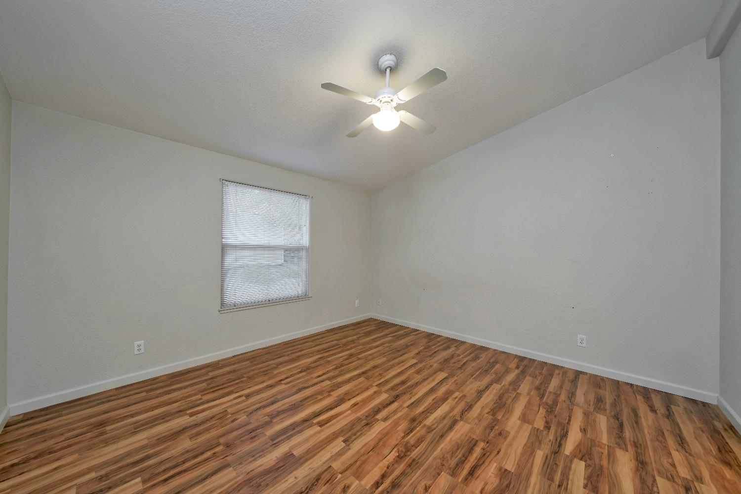3550 China Garden Road, Unit 102 Placerville, CA 95667 - Photo 18 of 30 wooden floor in an empty room with a window