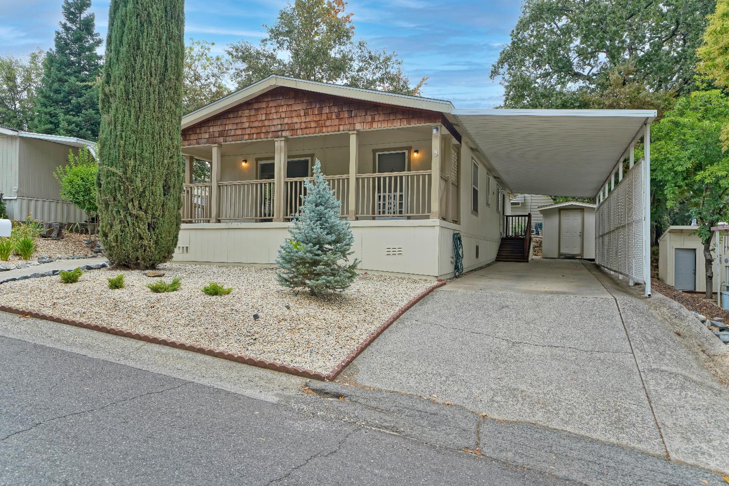 3550 China Garden Road, Unit 102 Placerville, CA 95667 - Photo 2 of 30 a front view of a house with a yard and potted plants