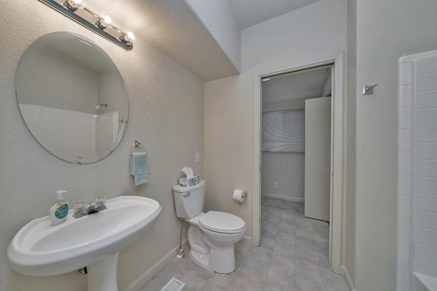 3550 China Garden Road, Unit 102 Placerville, CA 95667 - Photo 22 of 30 a bathroom with a toilet a sink and a mirror