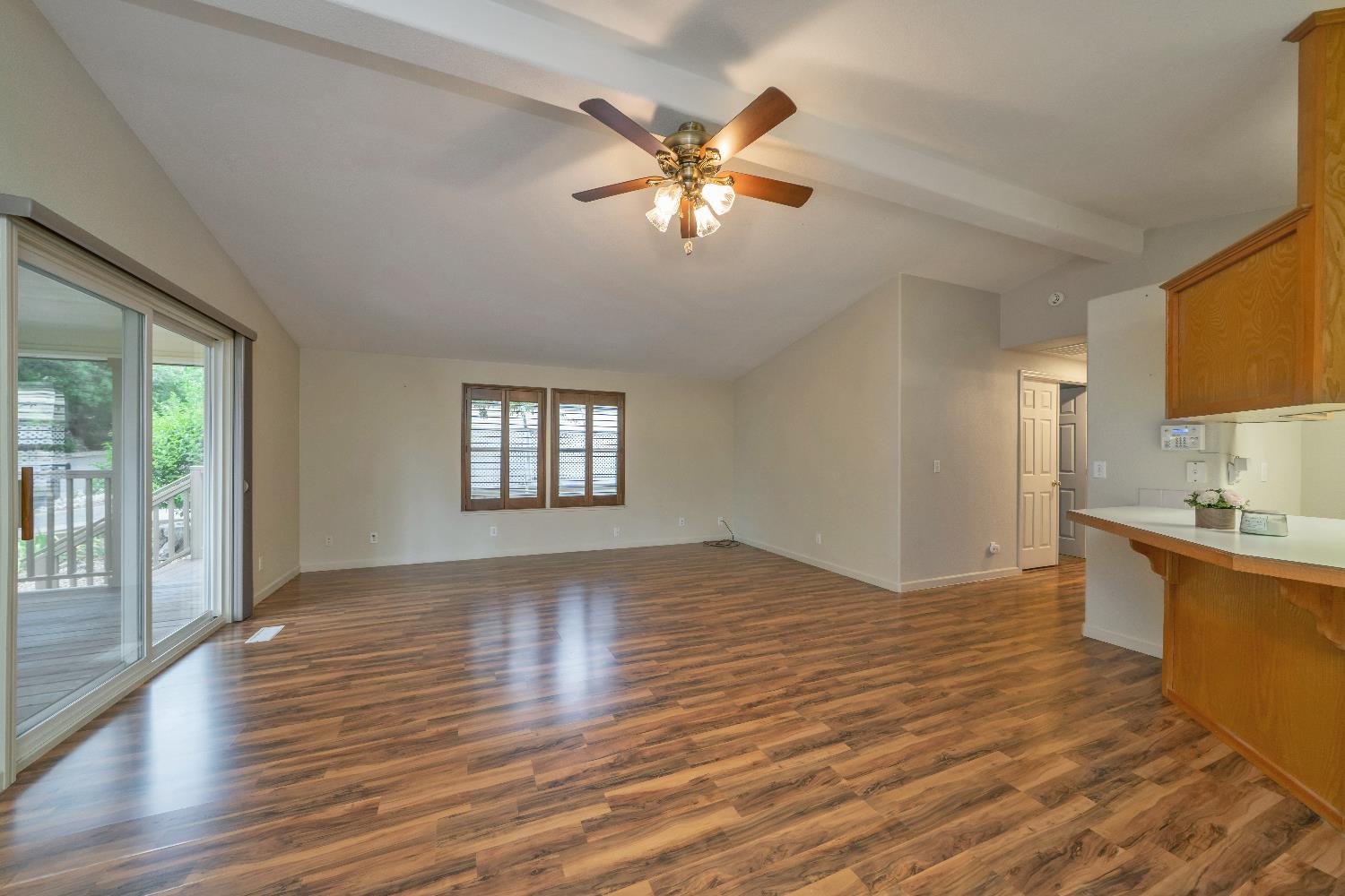 3550 China Garden Road, Unit 102 Placerville, CA 95667 - Photo 7 of 30 a view of an empty room with window and wooden floor