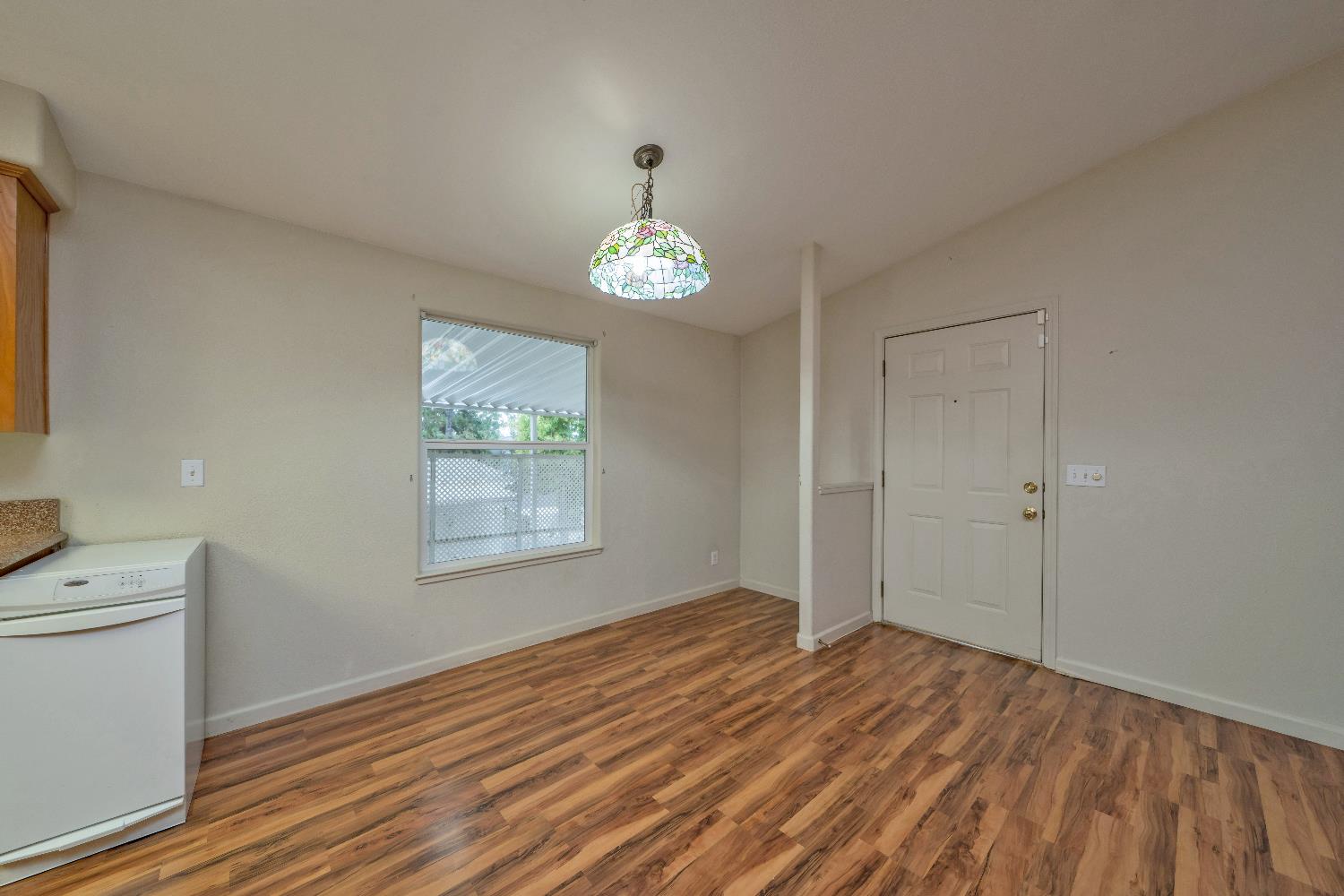 3550 China Garden Road, Unit 102 Placerville, CA 95667 - Photo 9 of 30 a view of a room with wooden floor and window