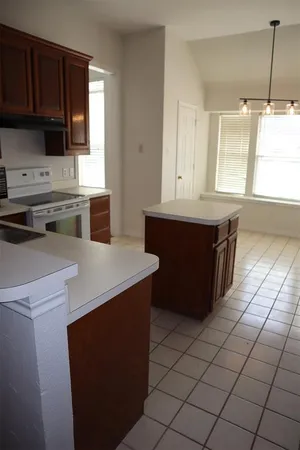 a kitchen with a cabinets and appliances