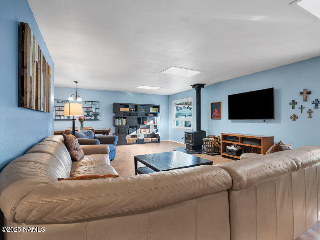 615 West Beal Road Flagstaff, AZ 86001 - Photo 11 of 37 a living room with furniture and a flat screen tv