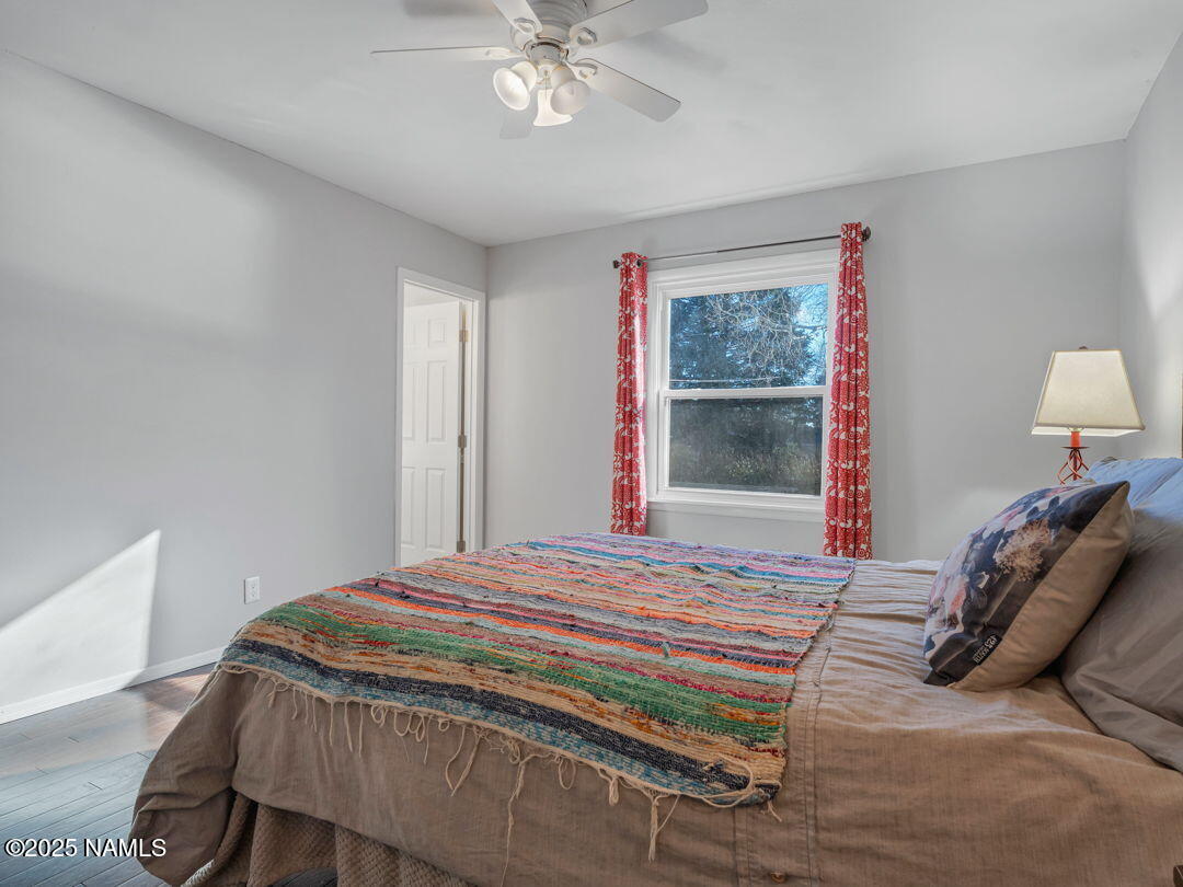 615 West Beal Road Flagstaff, AZ 86001 - Photo 18 of 37 a bedroom with a bed and a window