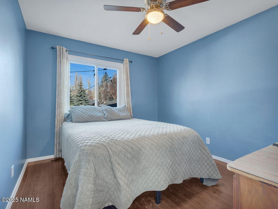 615 West Beal Road Flagstaff, AZ 86001 - Photo 22 of 37 a bedroom with a bed and window