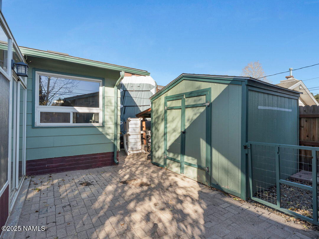 615 West Beal Road Flagstaff, AZ 86001 - Photo 36 of 37 a yellow house with a outdoor space