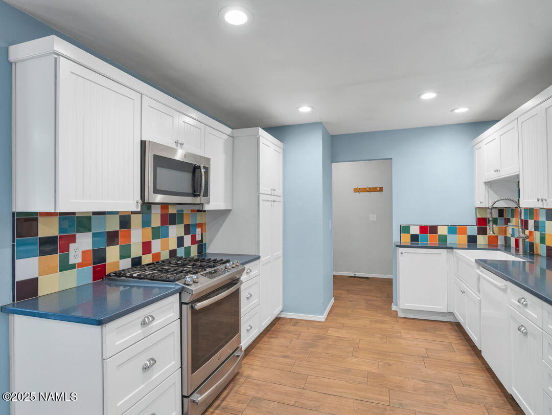 615 West Beal Road Flagstaff, AZ 86001 - Photo 7 of 37 a kitchen with refrigerator and microwave