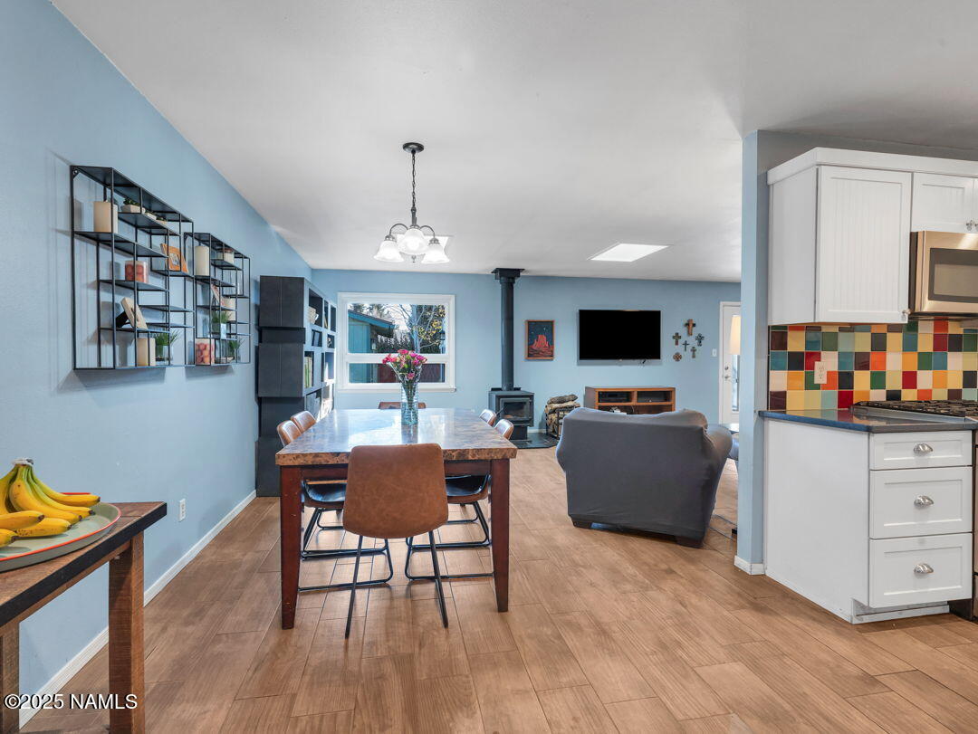615 West Beal Road Flagstaff, AZ 86001 - Photo 9 of 37 a living room with furniture and a flat screen tv