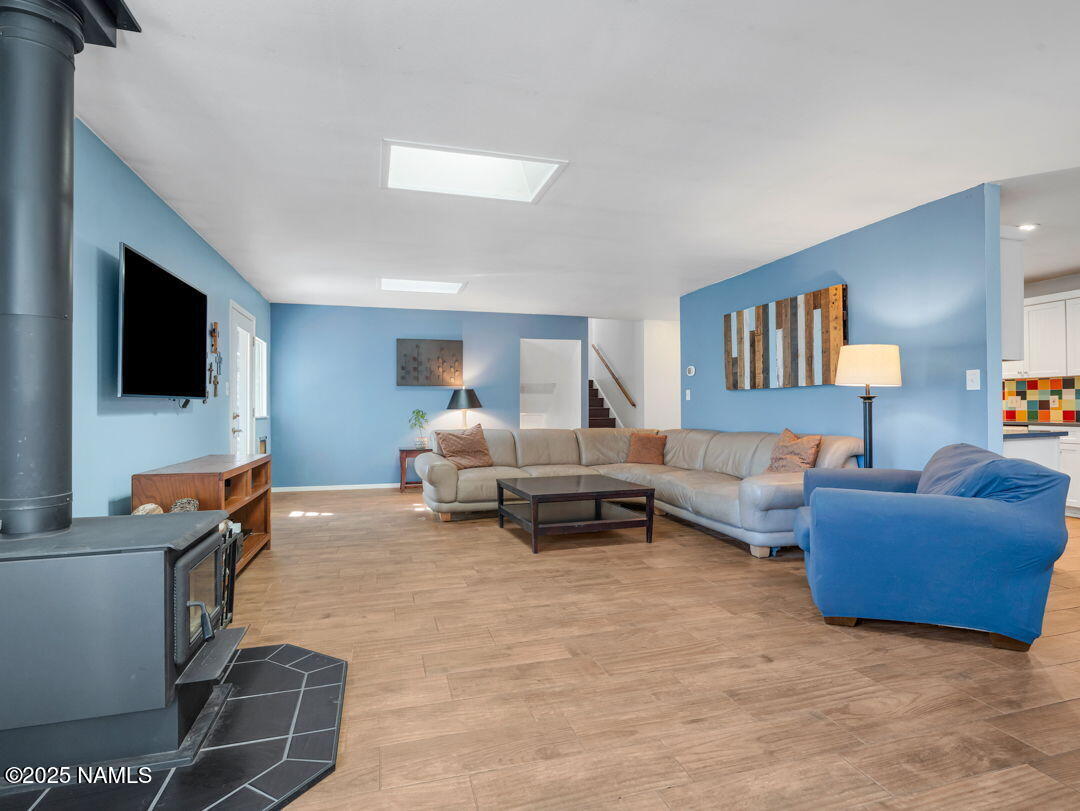 615 West Beal Road Flagstaff, AZ 86001 - Photo 10 of 37 a living room with furniture and a flat screen tv