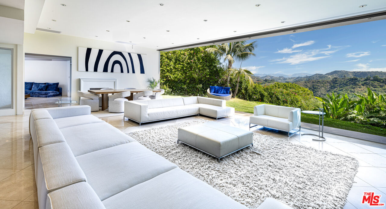 1466 Bel Air Road Los Angeles, CA 90077 - Photo 3 of 35 a living room with furniture and a large window