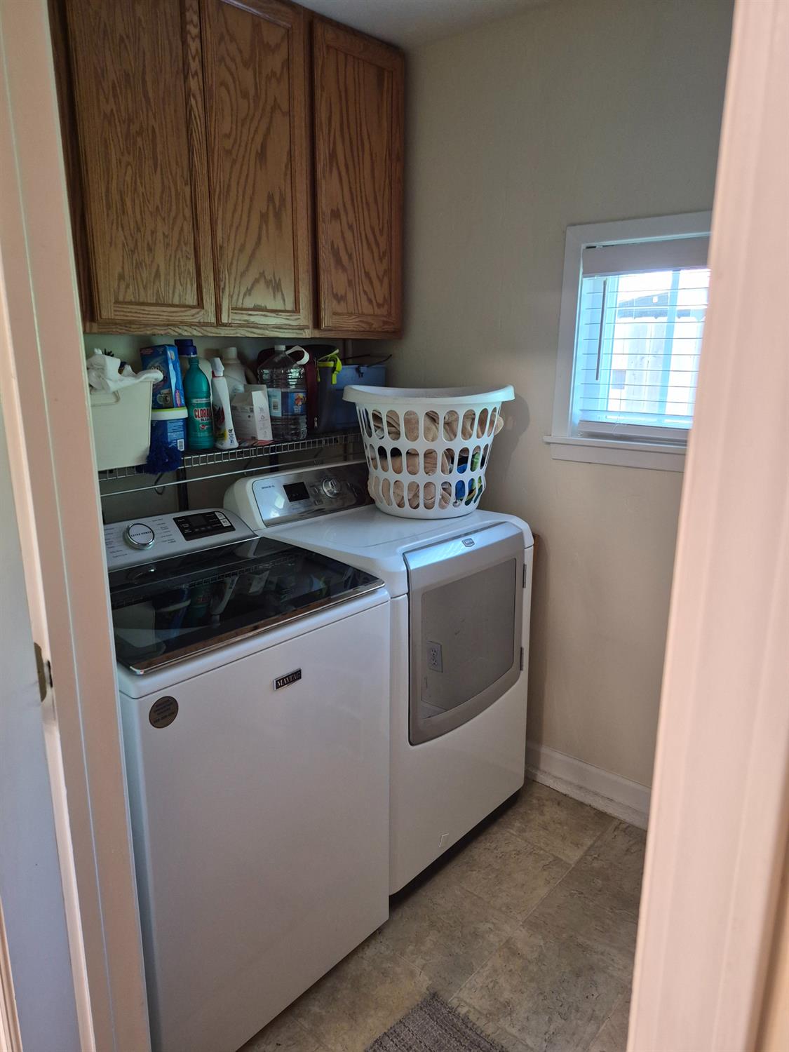 5817 Keyntel Street Citrus Heights, CA 95621 - Photo 19 of 30 a kitchen with stove cabinets and window