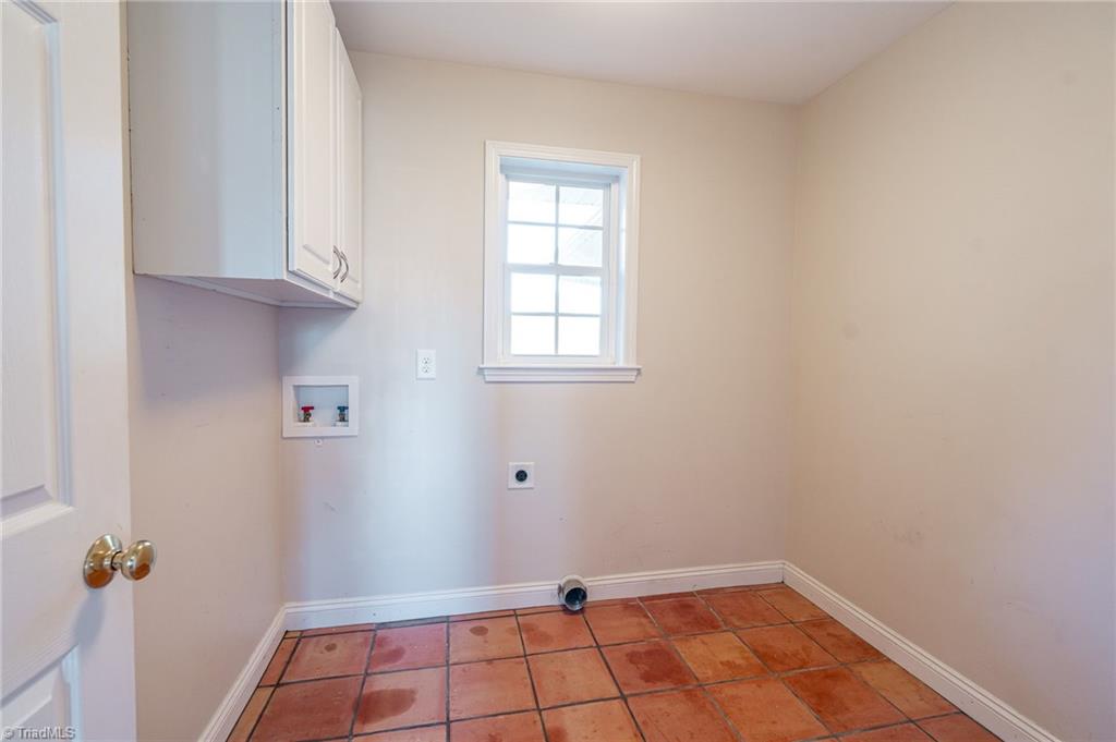 5723 Thom Road Graham, NC 27253 - Photo 10 of 41 Laundry Room off Foyer and has pull down stairs to attic