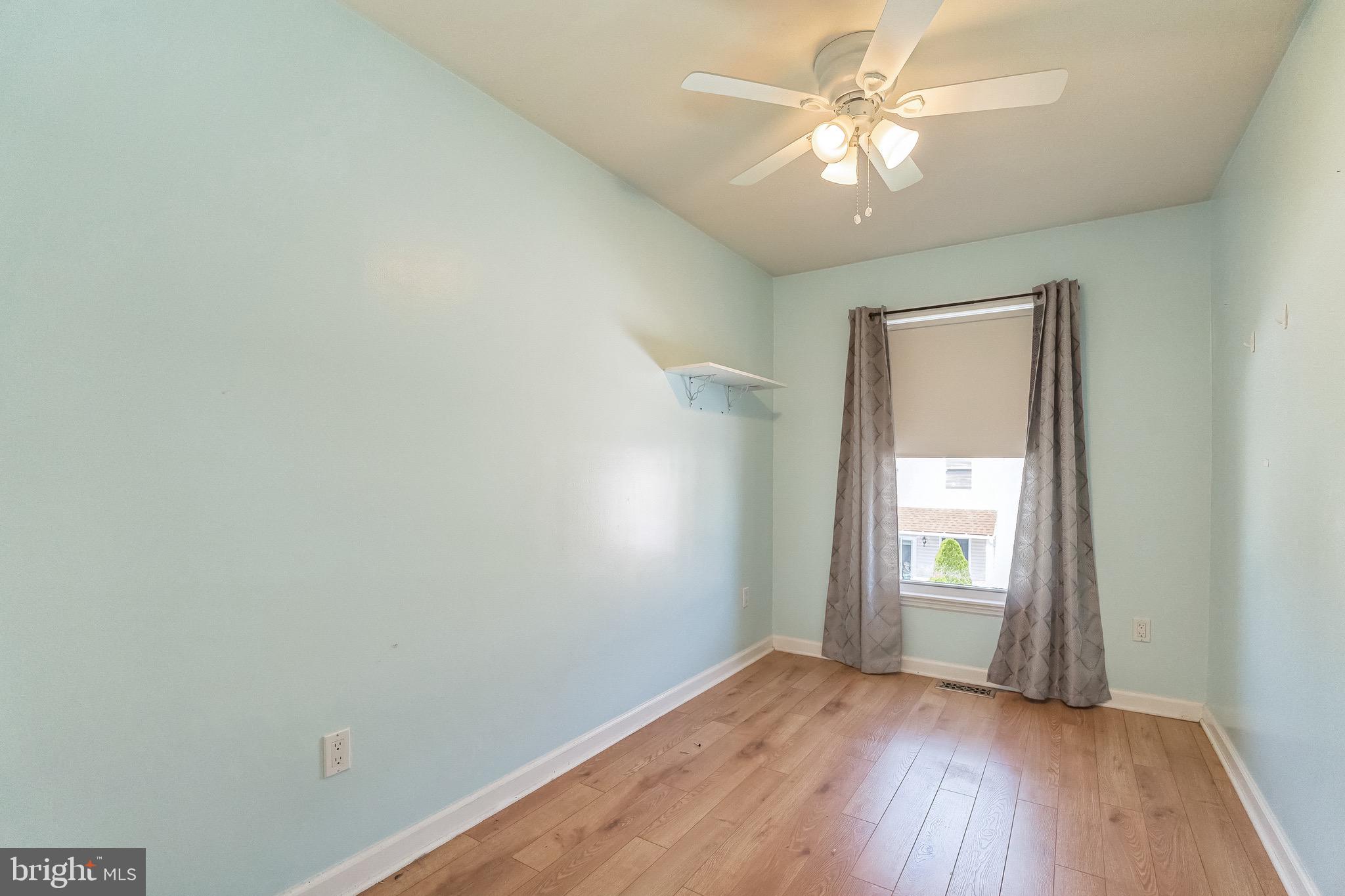 3566 Edgemont Street Philadelphia, PA 19134 - Photo 20 of 25 wooden floor in an empty room with a window