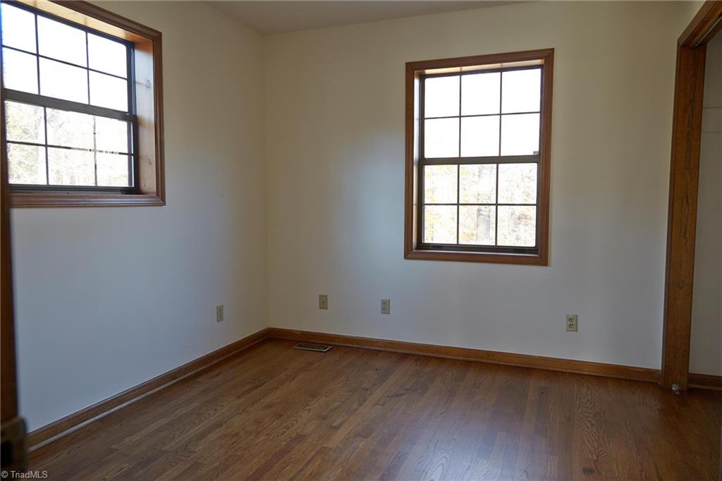 544 Neal Road Madison, NC 27025 - Photo 11 of 28 Main level bedroom with hardwood floors.