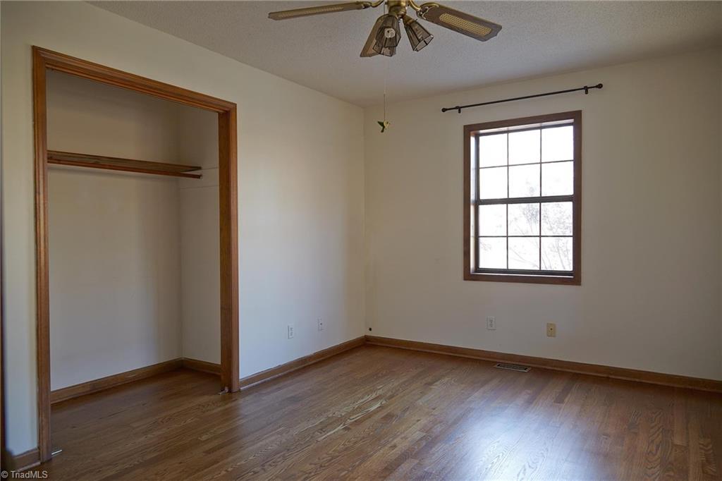 544 Neal Road Madison, NC 27025 - Photo 12 of 28 This room is off the living area and would work great as a formal dining room. Because it has a closet, it could be used as a bedroom.
