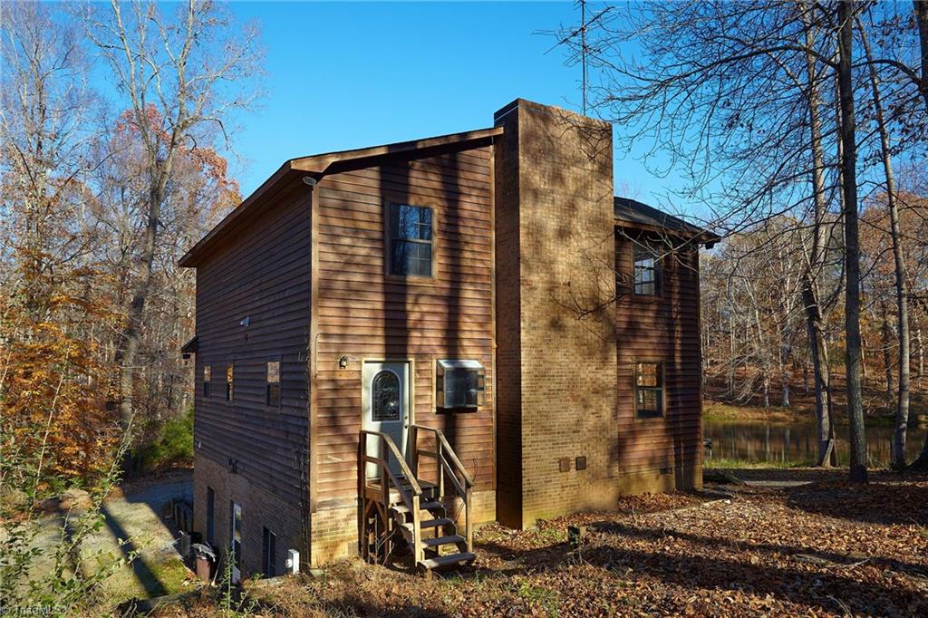 544 Neal Road Madison, NC 27025 - Photo 5 of 28 Back view of home with entrance to kitchen. Two full stories plus a finished basement! And there's room on the left to add a large garage!