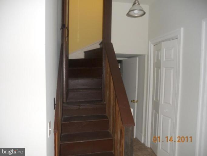 703 Locust Street Cambridge, MD 21613 - Photo 23 of 27 REAR STAIRWELL