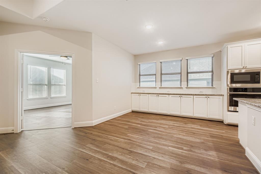 312 Magnolia Drive Oak Point, TX 75068 - Photo 11 of 28 Unfurnished dining area with plenty of natural light, light wood-type flooring, and recessed lighting
