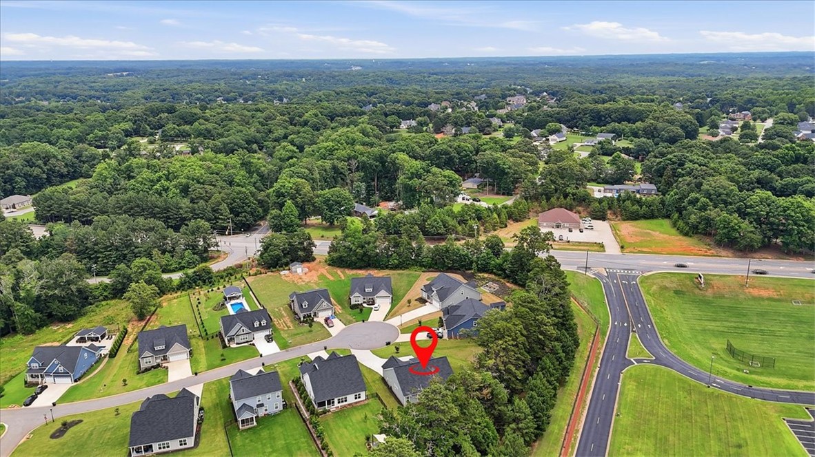 214 Timothy Court Anderson, SC 29621 - Photo 40 of 43 An aerial perspective reveals a vibrant neighborhood with well-maintained homes nestled amidst verdant landscapes and convenient road access.