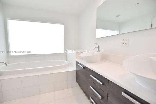 a bathroom with a sink and a bathtub