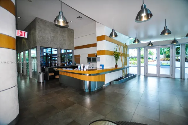 a room with lots of table and chairs