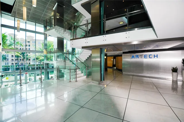 a view of a house with a yard and a sitting area