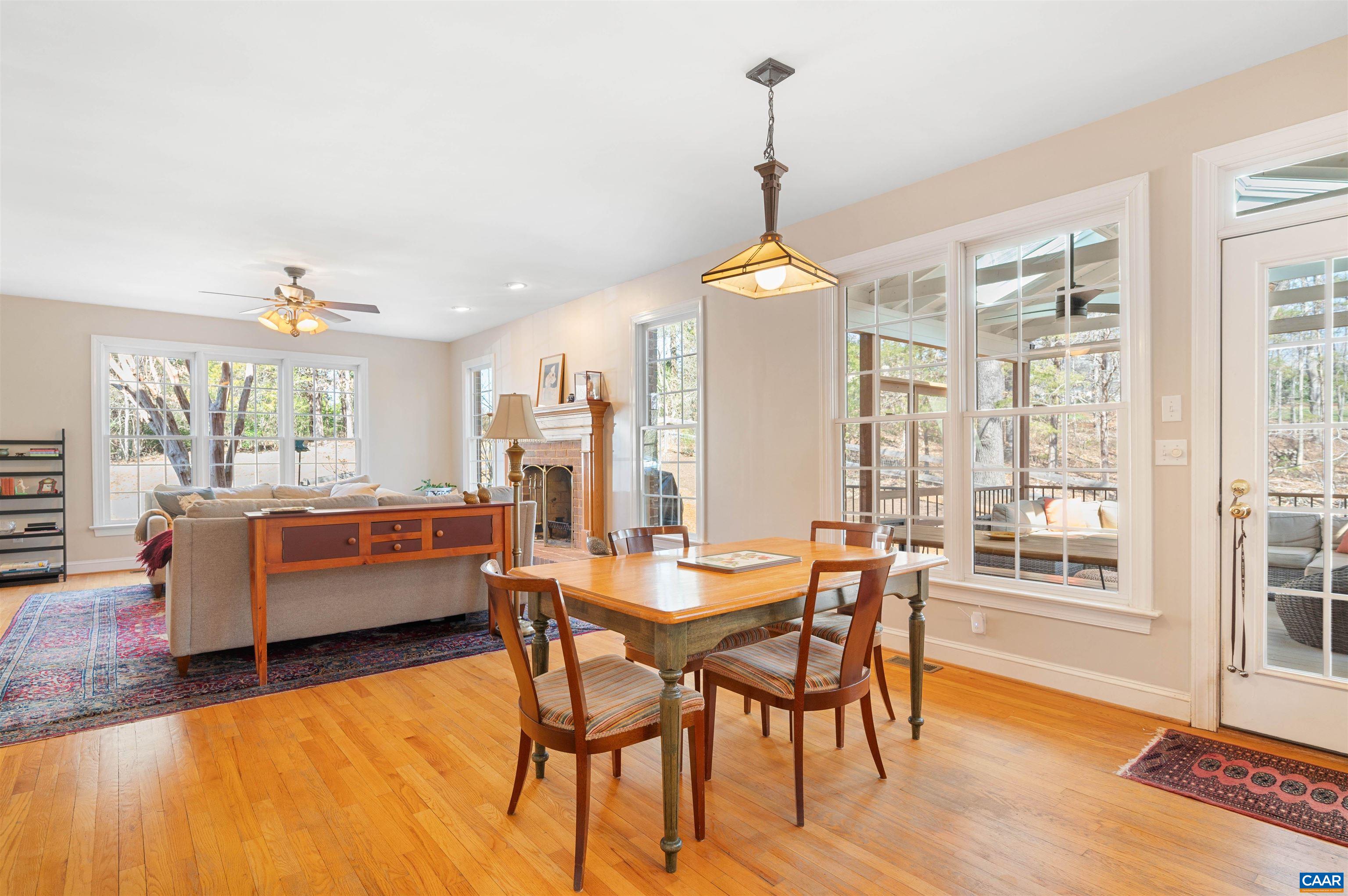 891 Old Ballard Road Charlottesville, VA 22901 - Photo 17 of 49 a dining room with furniture a chandelier and wooden floor