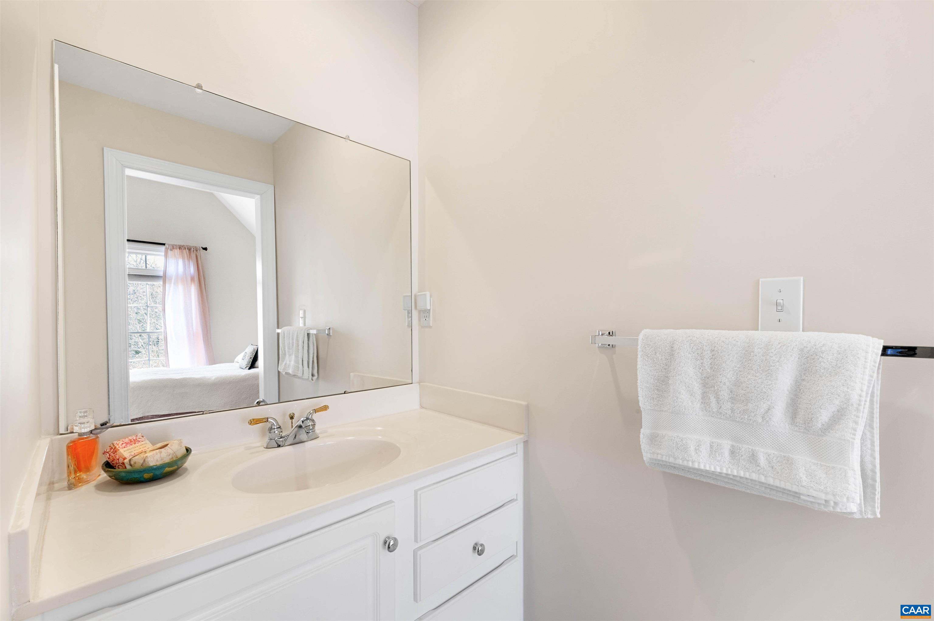 891 Old Ballard Road Charlottesville, VA 22901 - Photo 40 of 49 a bathroom with a sink and a mirror