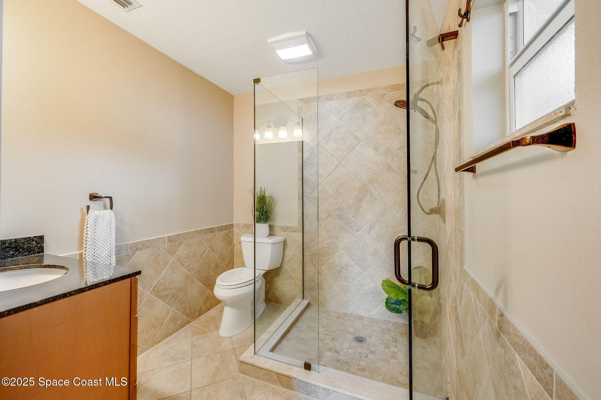 7081 Bayfront Road Cocoa, FL 32927 - Photo 13 of 45 a bathroom with a shower