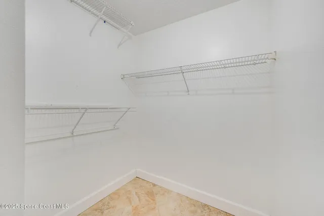 a view of a room with racks on the wall