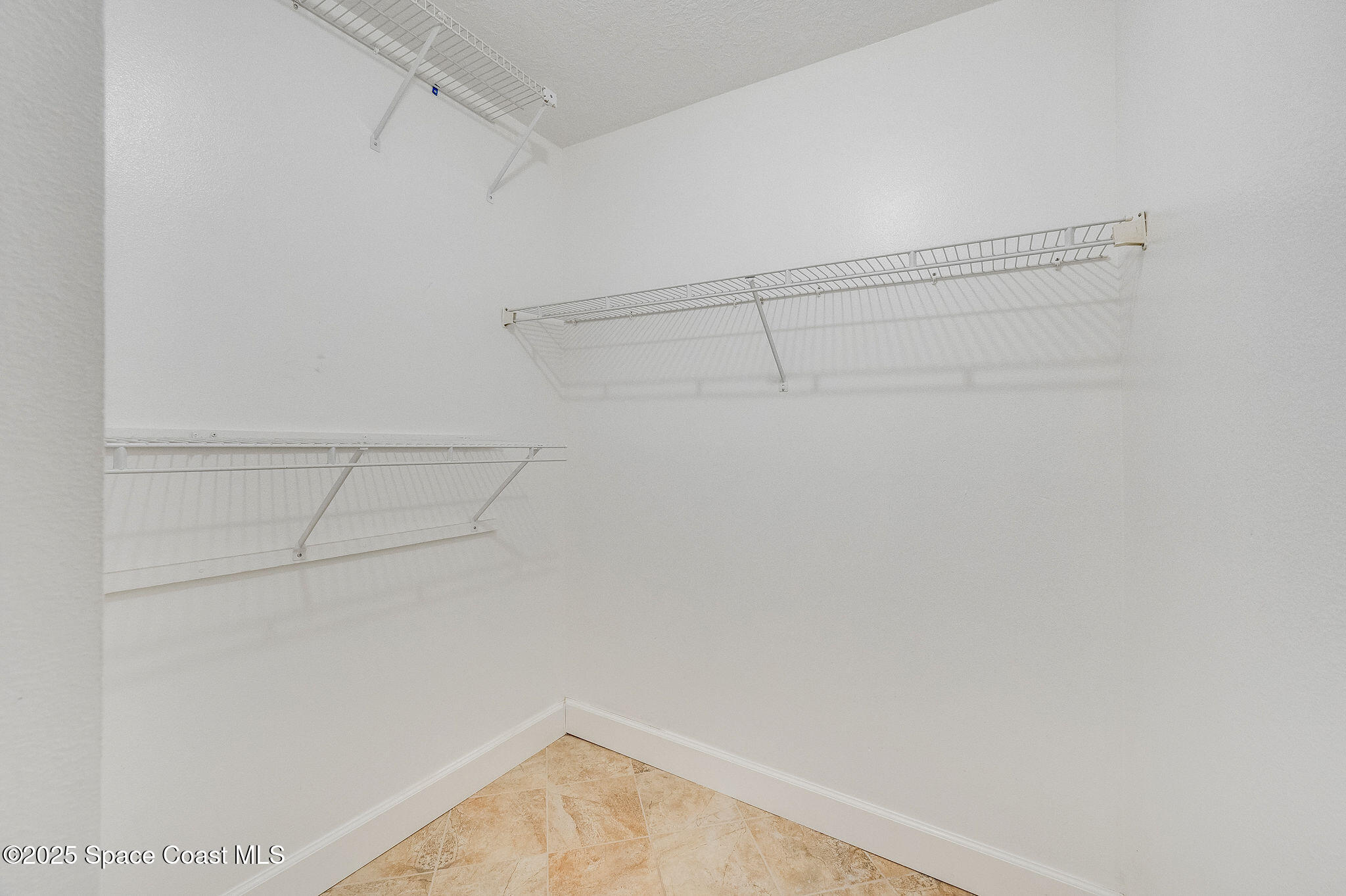 7081 Bayfront Road Cocoa, FL 32927 - Photo 15 of 45 a view of a room with racks on the wall