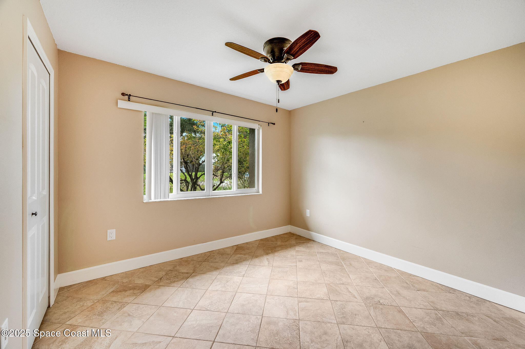 7081 Bayfront Road Cocoa, FL 32927 - Photo 19 of 45 a view of an empty room with a window
