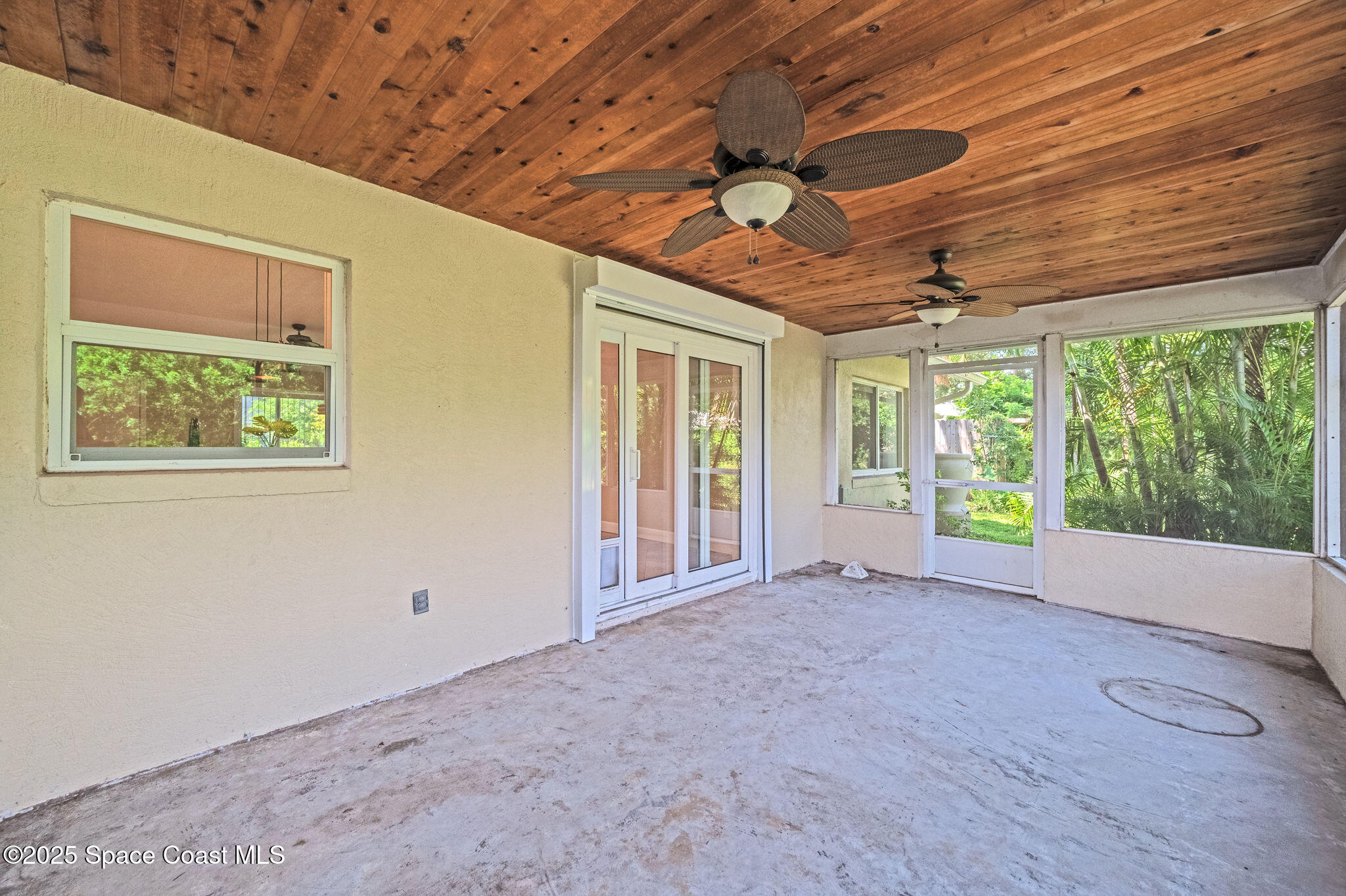 7081 Bayfront Road Cocoa, FL 32927 - Photo 23 of 45 a view of an empty room with a window