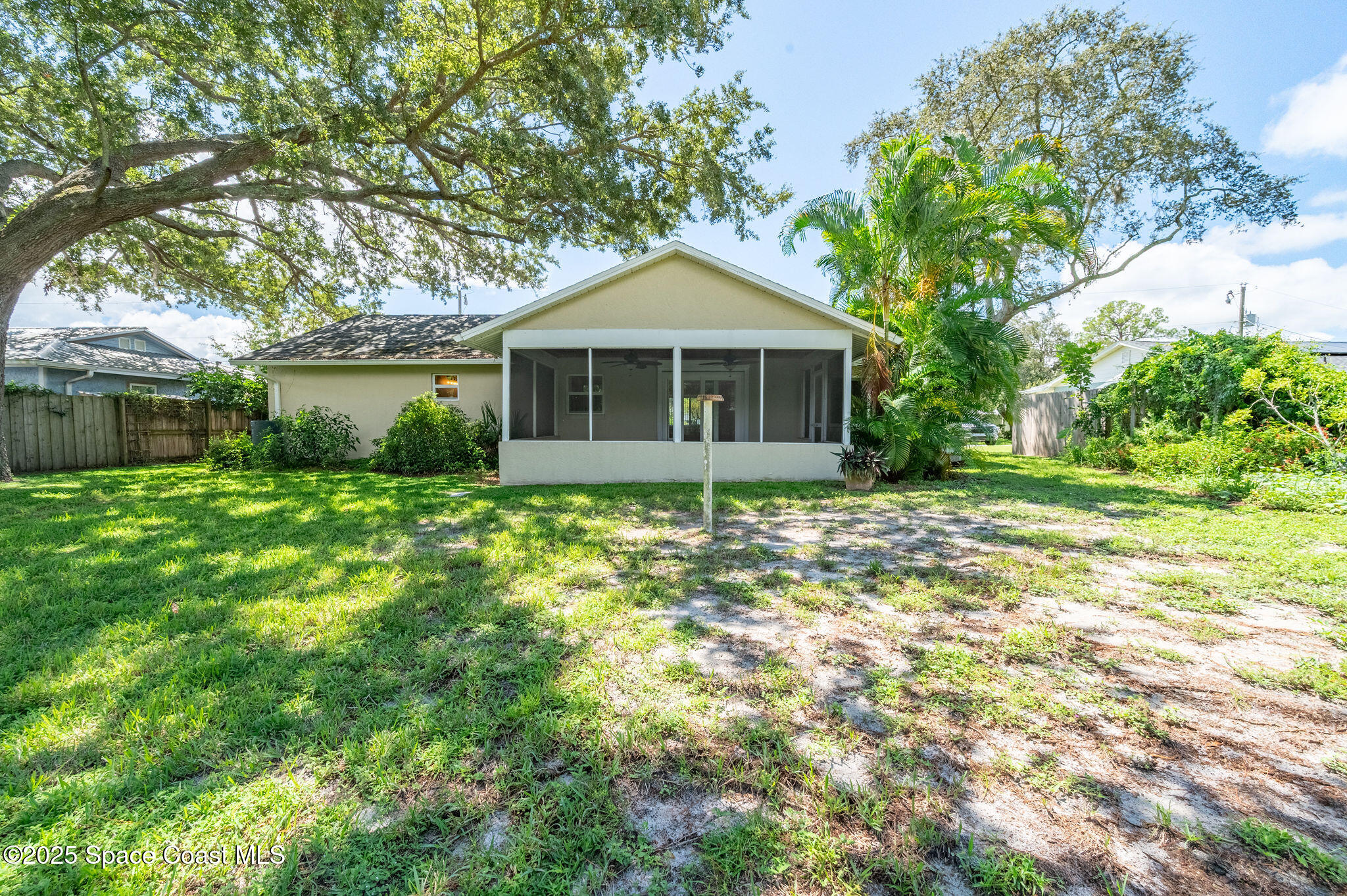 7081 Bayfront Road Cocoa, FL 32927 - Photo 25 of 45 a front view of house with yard and green space