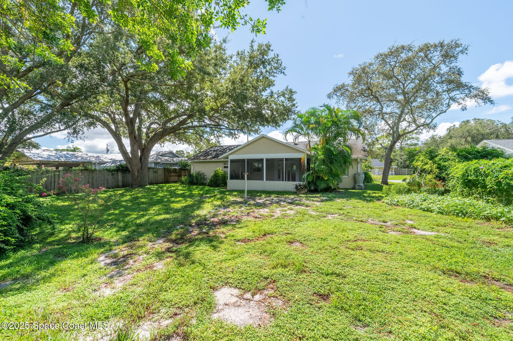 7081 Bayfront Road Cocoa, FL 32927 - Photo 26 of 45 a front view of a house with garden
