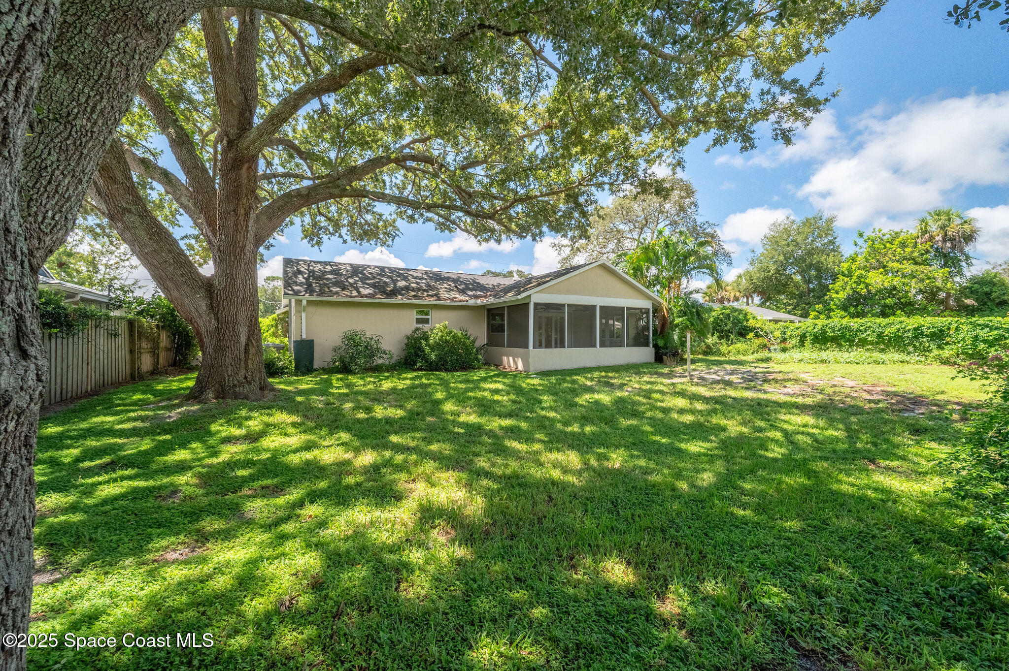 7081 Bayfront Road Cocoa, FL 32927 - Photo 27 of 45 a front view of a house with garden