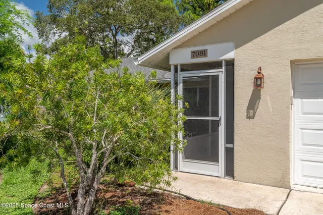 a yellow house with a outdoor space