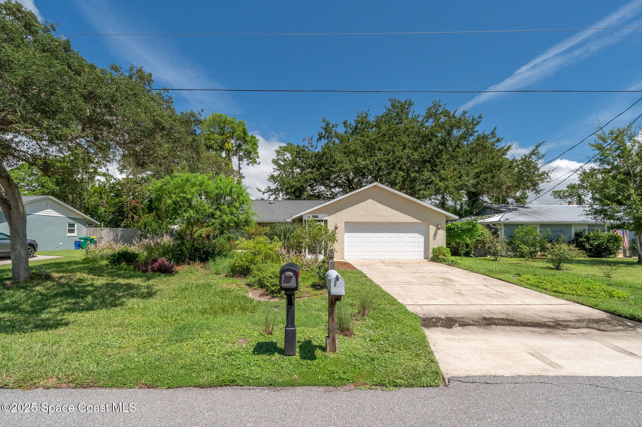 7081 Bayfront Road Cocoa, FL 32927 - Photo 33 of 45 a front view of a house with a yard