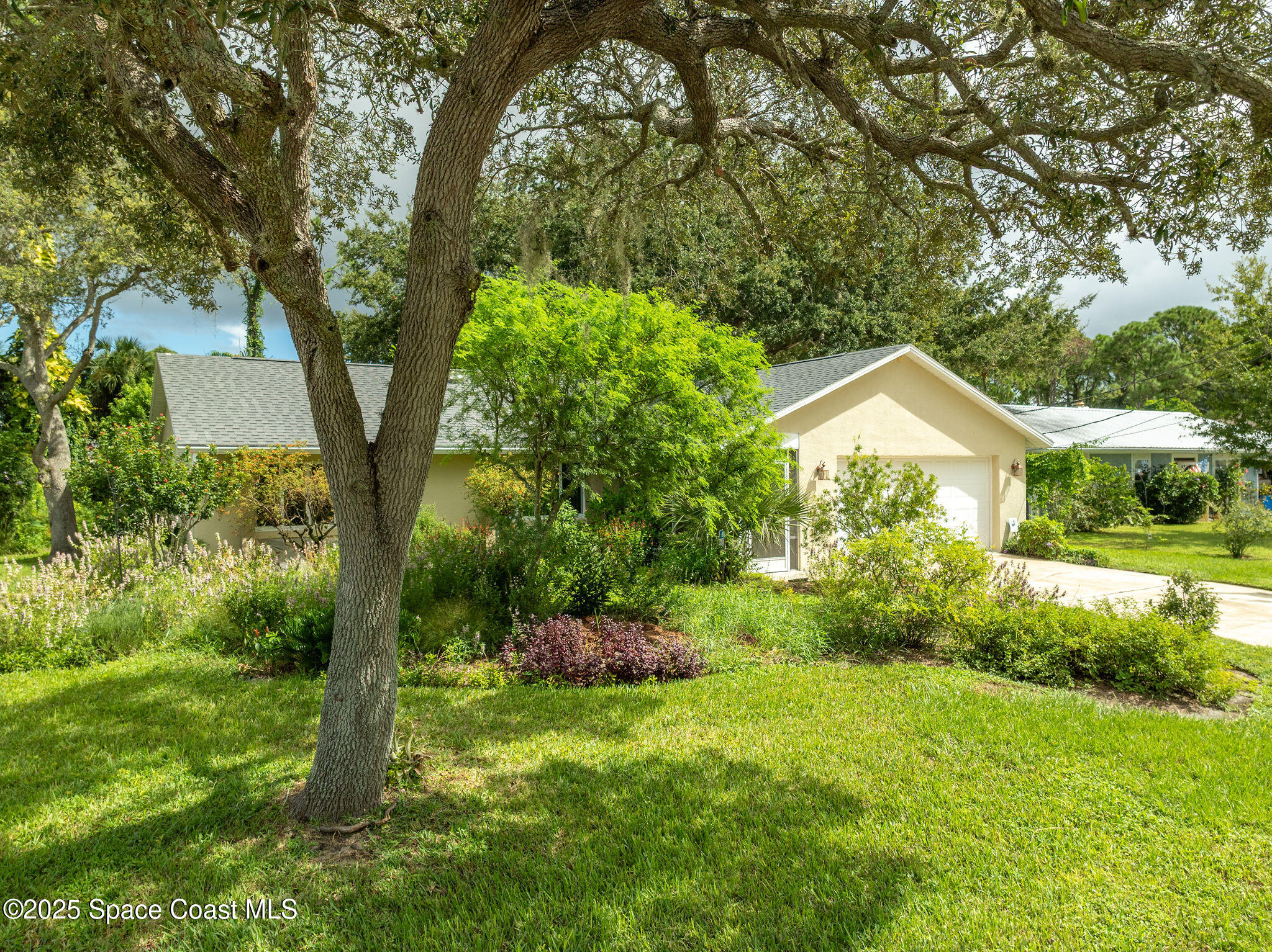 7081 Bayfront Road Cocoa, FL 32927 - Photo 37 of 45 a front view of a house with garden