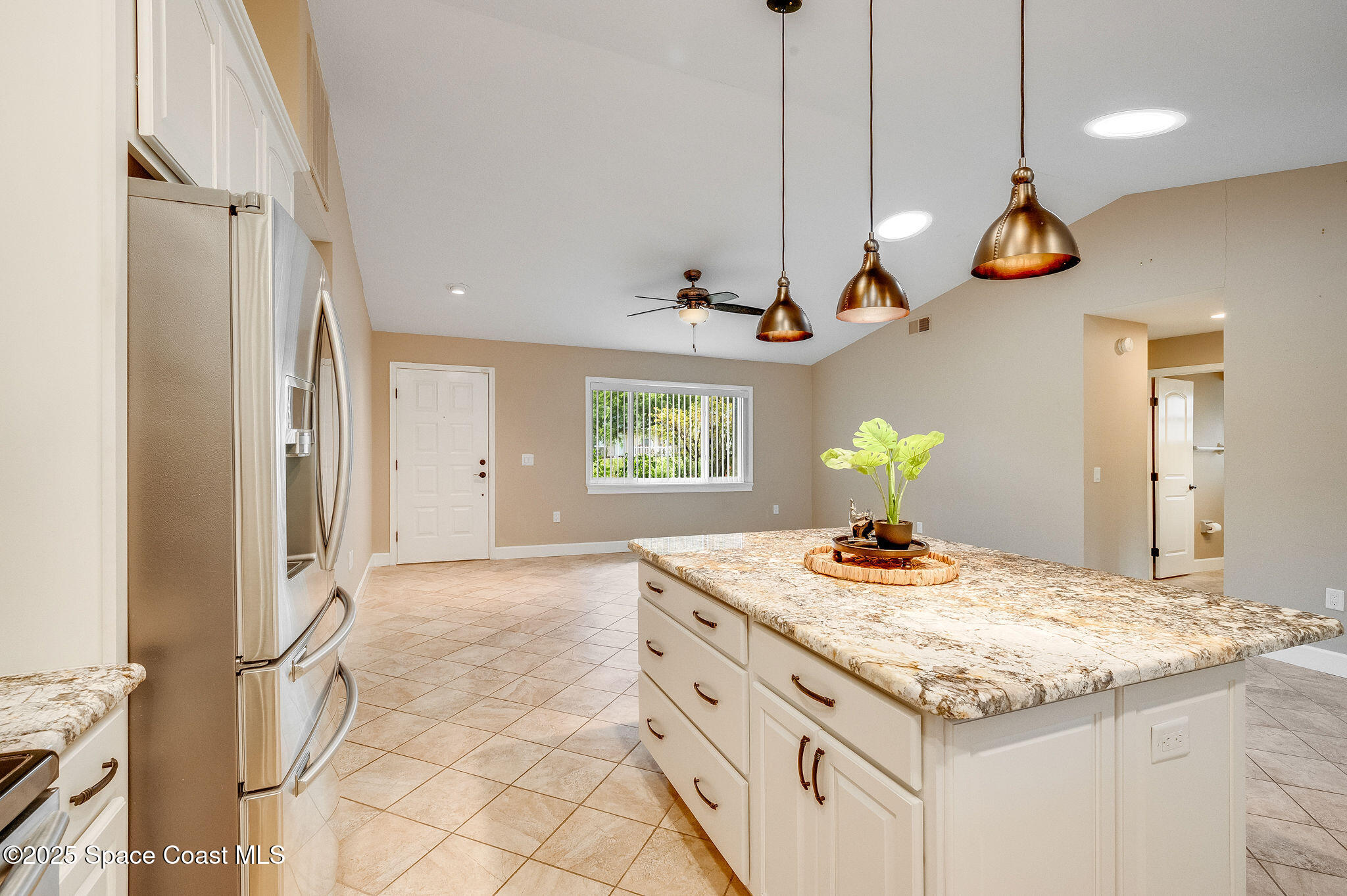 7081 Bayfront Road Cocoa, FL 32927 - Photo 4 of 45 a bathroom with a granite countertop sink a vanity and a large mirror