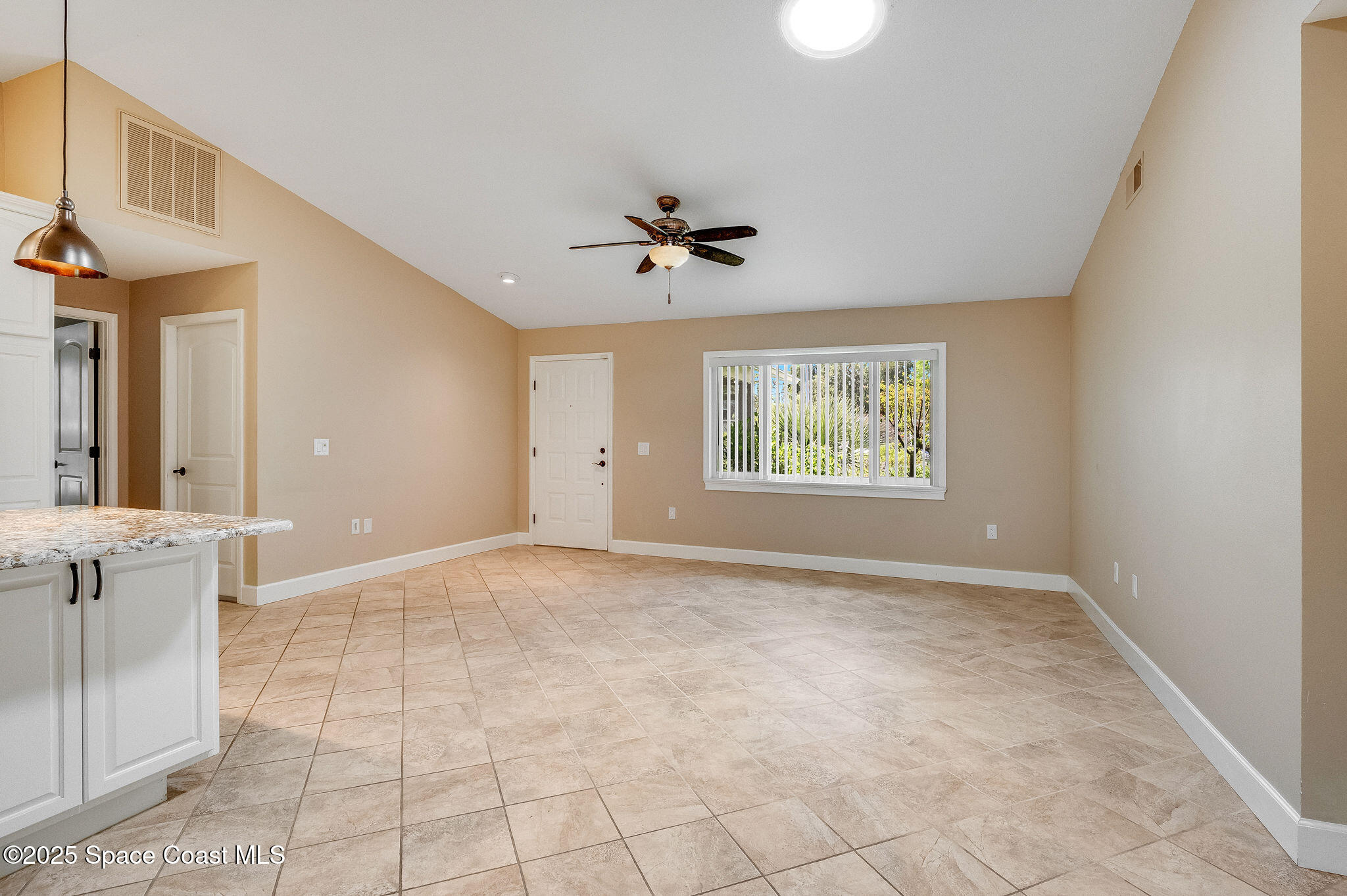 7081 Bayfront Road Cocoa, FL 32927 - Photo 6 of 45 a view of an empty room with a window