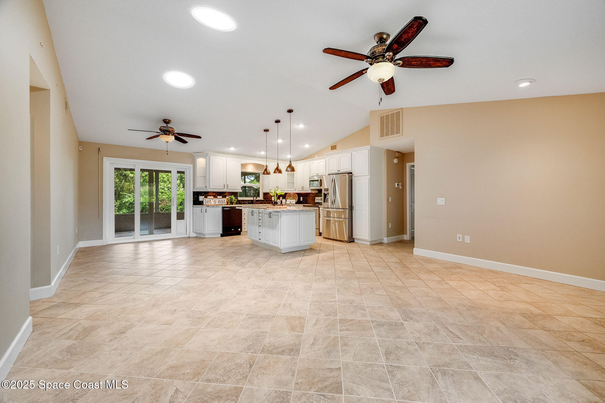 7081 Bayfront Road Cocoa, FL 32927 - Photo 7 of 45 a view of a kitchen with a sink and a window